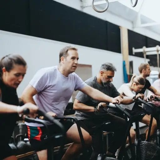Members working out with bicycles