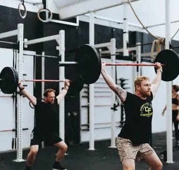 Men lifting heavy weights